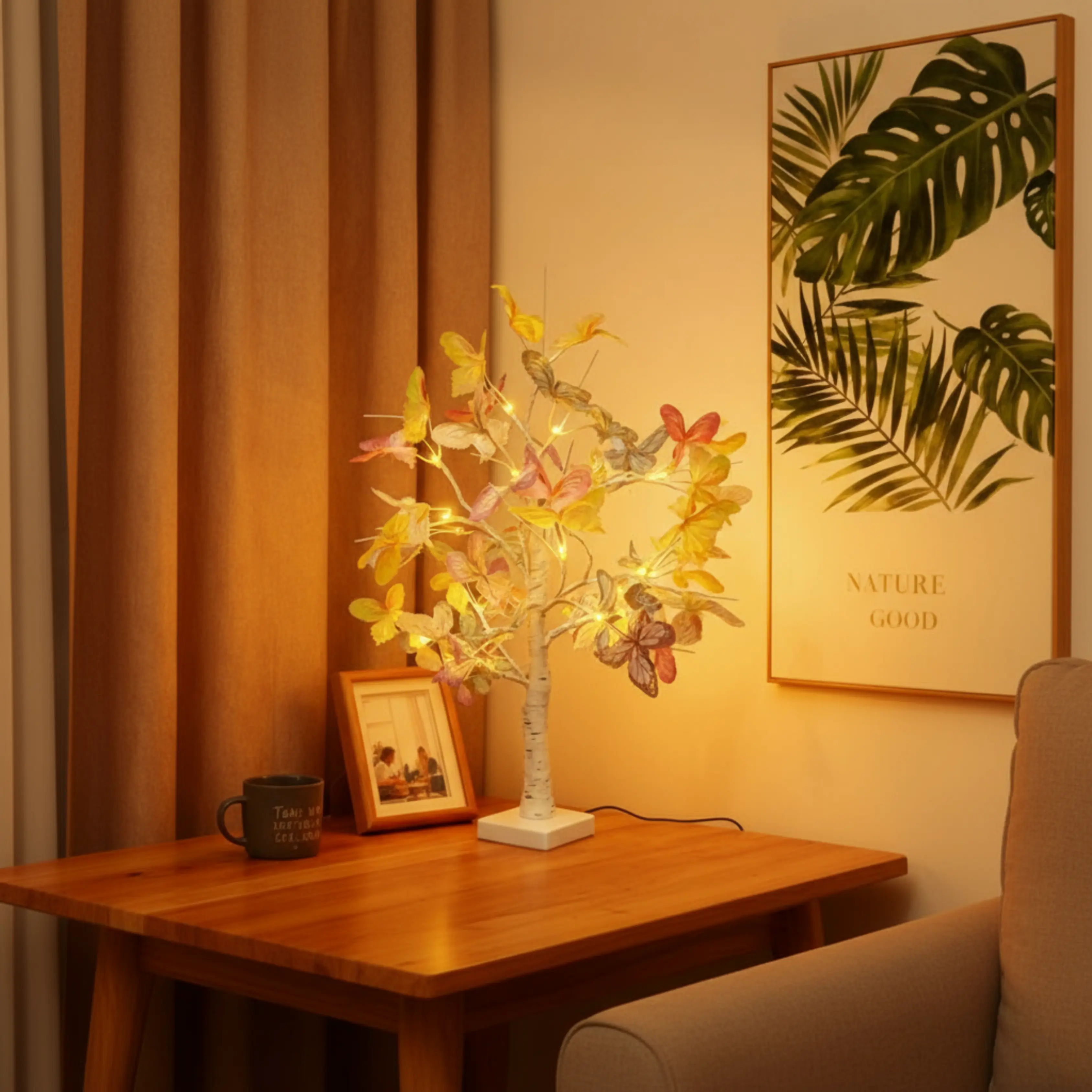 60cm LED butterfly tree lamp glowing with warm white light on a bedroom nightstand in Dubai, pastel butterflies visible in soft yellow, pink, and blue