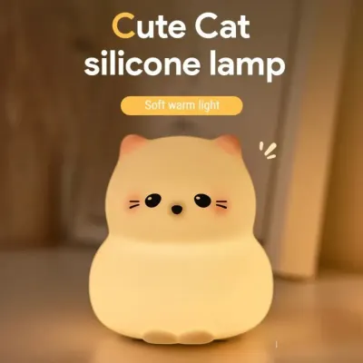 Cute cat night light glowing with warm white light on a child’s bedside table in a Dubai nursery at night